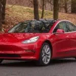 The Cheapest Tesla Model Electric Vehicle - Red Color